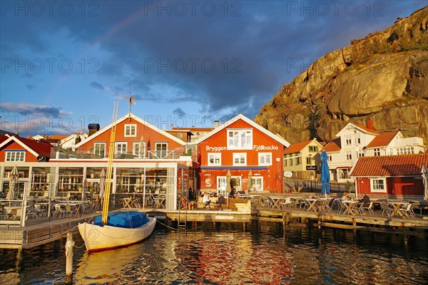 Small harbour with restaurants and rocks in the last light of the day, autumn atmosphere, Fjaellbacka, Vaestra, Goetlands, Sweden, Europe