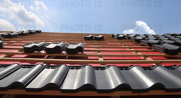 Panoramic image of the roof covering of a new tiled roof on a residential building