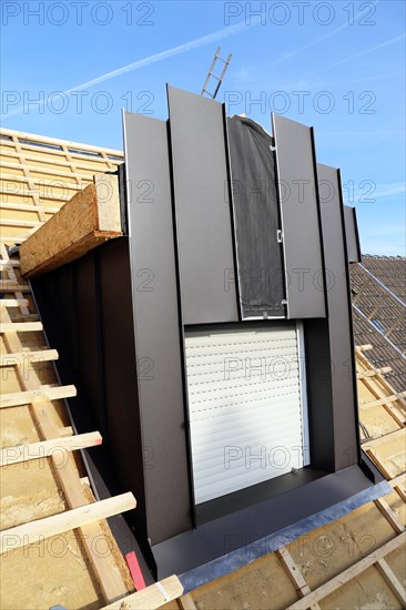 Roofer working on a new dormer window