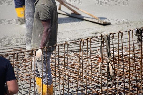 Concreting a floor slab with ready-mixed concrete on the construction site of a residential building