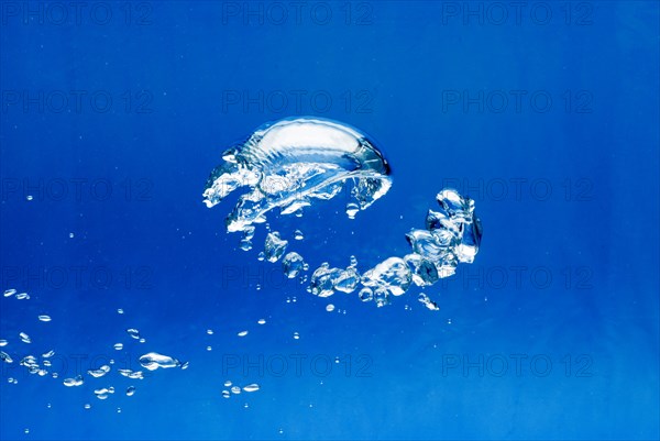 Bright Air bubbles, blue background in an aquarium