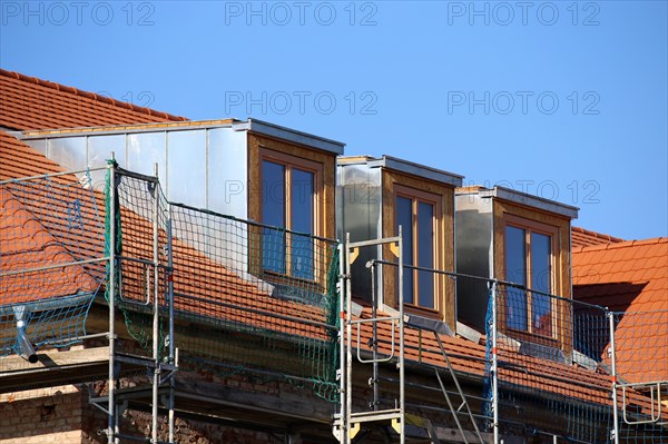 Roofer working on a new dormer window