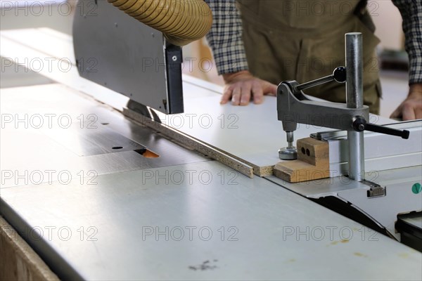 Carpenter at work in his carpentry workshop