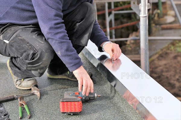 Tinsmith work on a flat roof