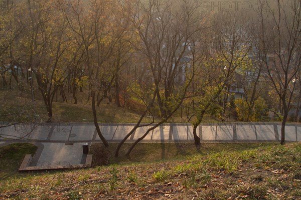 City park at sunset in the fog. Kiev, Ukraine. october 2019