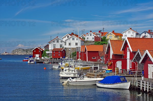 Fishing huts, houses and small boats on the car-free island of Gullhomen, Idyll, Oerust, Sweden, Europe