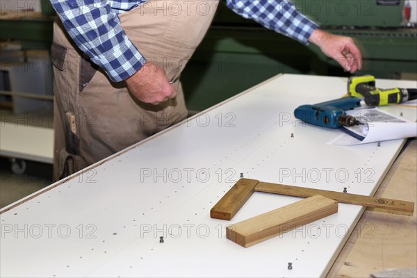 Carpenter at work in his carpentry workshop