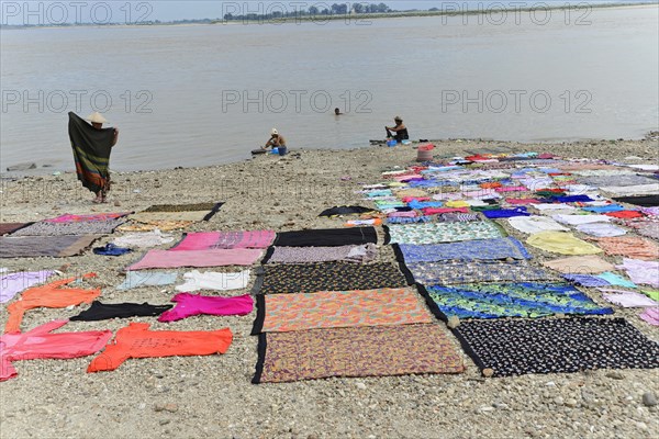 Washing clothes in the Irrawaddy, Myanmar, Asia