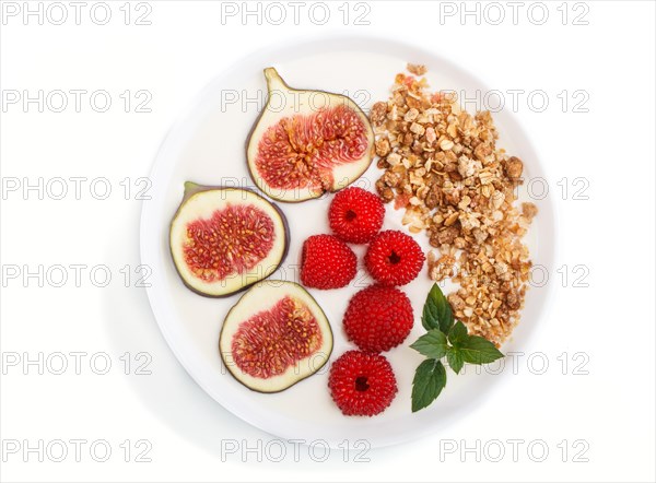 Yoghurt with raspberry, granola and figs in white plate isolated on white background. top view, flat lay, close up