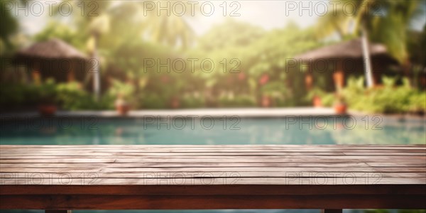 Wooden table with troical garden and swimming pool in blurry background. KI generiert, generiert AI generated