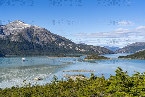 Cruise ship Stella Australis anchored between ice floes in Pia Bay in front of the Pia Glacier, Alberto de Agostini National Park, Avenue of the Glaciers, Chilean Arctic, Patagonia, Chile, South America