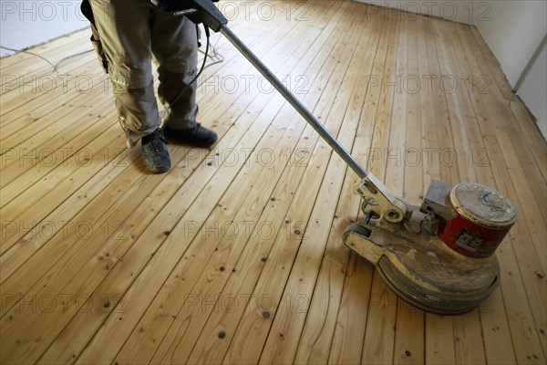 A parquet floor is sanded and oiled