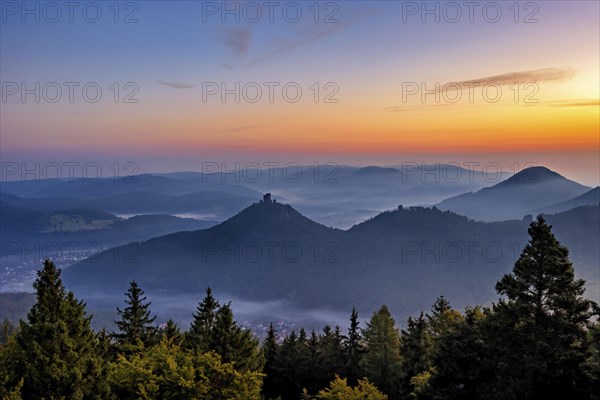 Trifels Castle in the Palatinate Forest in the morning mist at sunrise