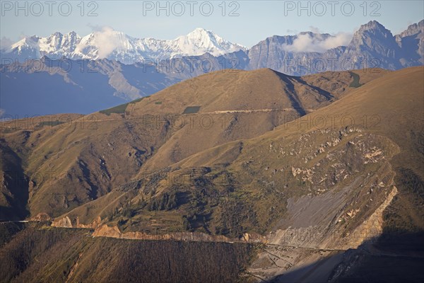 Road through the Andean highlands, snow-capped Andes in the background, Andahuaylas, Apurimac. region, Peru, South America