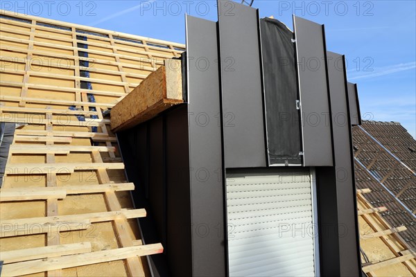 Roofer working on a new dormer window