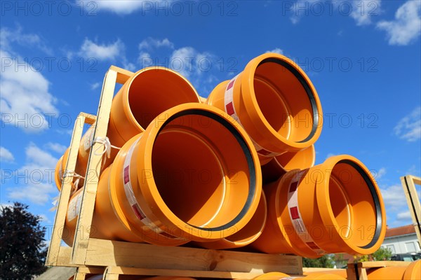 Stack of KG pipes on a construction site in the Mutterstadt development area, Rhineland-Palatinate