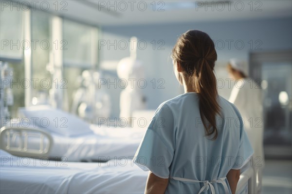 Back view of nurse looking at hospital beds. KI generiert, generiert AI generated