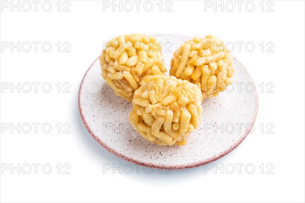 Traditional Tatar candy chak-chak made of dough and honey isolated on white background. Side view, close up