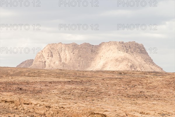 Desert, red mountains, rocks and cloudy sky. Egypt, color canyon, the Sinai Peninsula, Dahab