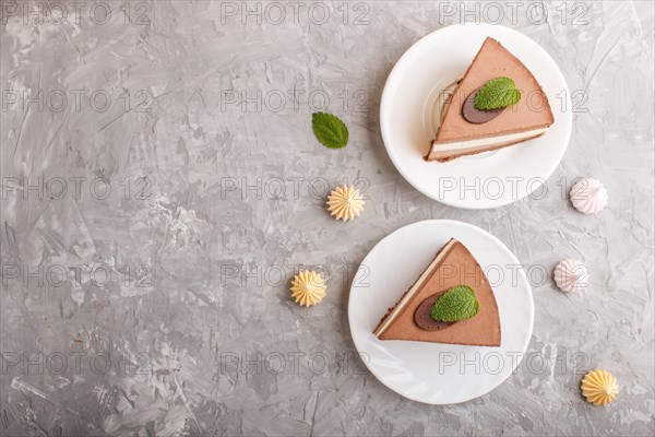 Cake with souffle milk chocolate cream on a gray concrete background. top view, flat lay, copy space