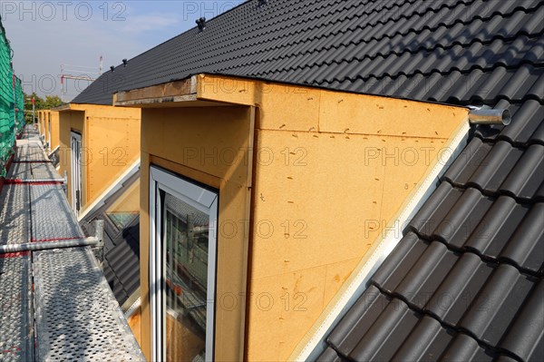 Roofer working on a new dormer window