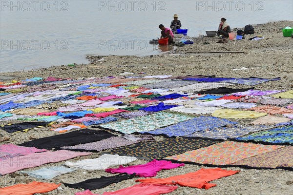 Washing clothes in the Irrawaddy, Myanmar, Asia