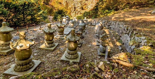 Collection of Buddhist stone carved urns on display at woodland park in South Korea