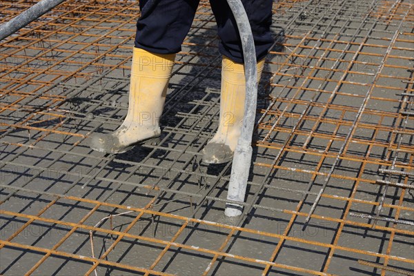 Concreting a floor slab with ready-mixed concrete on the construction site of a residential building