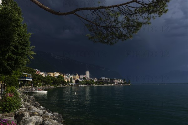 Lake Geneva promenade, thunderstorm, summer, rain, dramatic, dark sky, weather, palm tree, climate, travel, holiday, Alps, Montreux, Vaud, Switzerland, Europe