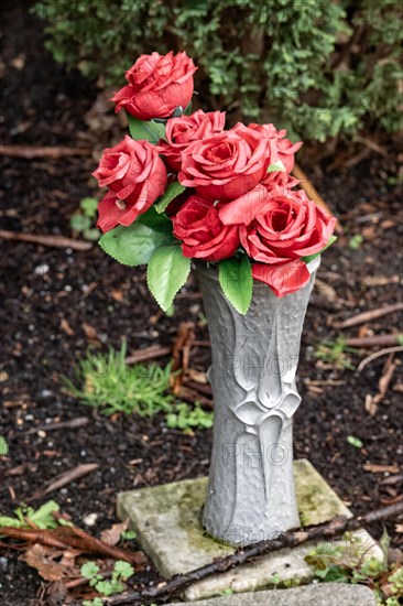 Artificial roses in a flower vase