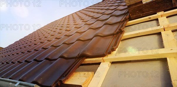 Panoramic image of the roof covering of a new tiled roof on a residential building