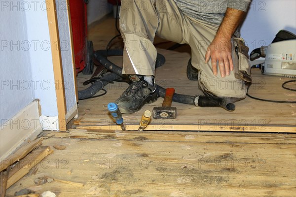 A parquet floor is sanded and oiled