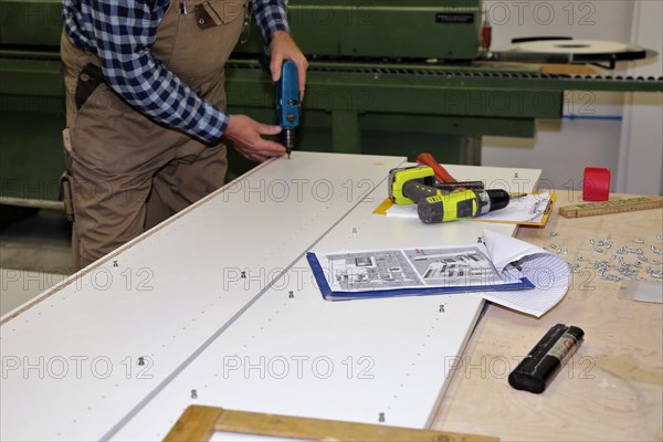 Carpenter at work in his carpentry workshop