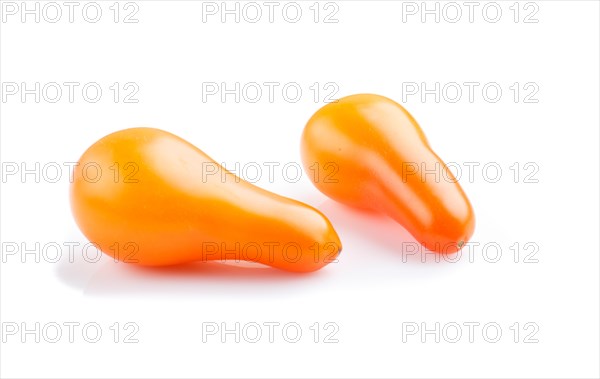 Two small ripe orange grape tomatoes isolated on white background. side view, close up