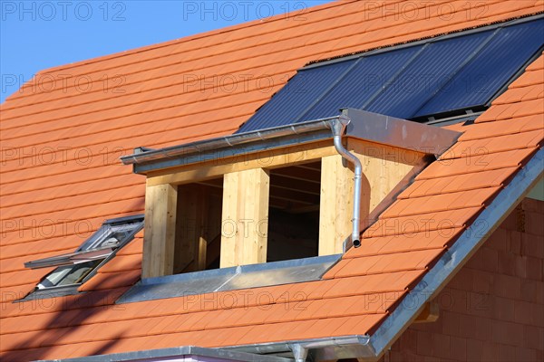 Roofer working on a new dormer window