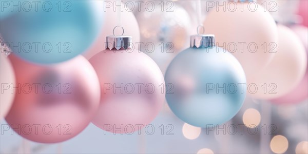 Pastel colored Christmas tree baubles on white strings. KI generiert, generiert AI generated