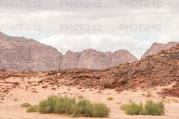 Desert, red mountains, rocks and cloudy sky. Egypt, color canyon, the Sinai Peninsula, Dahab