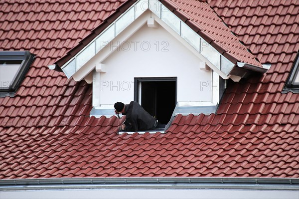 Tinsmith work on a newly covered roof