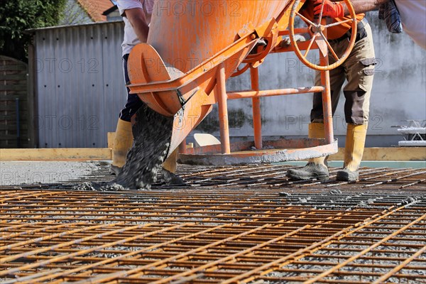 Concreting a floor slab with ready-mixed concrete on the construction site of a residential building