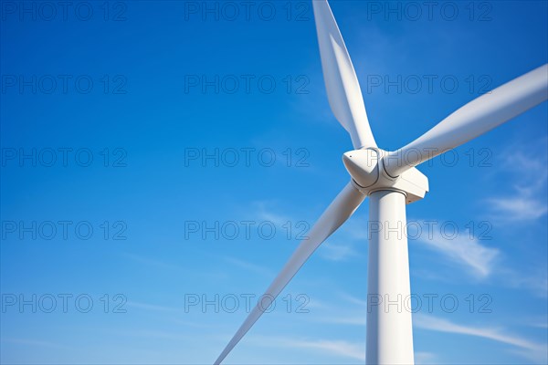 Wind mill turbine in front of blue sky. Renewable energy concpet. KI generiert, generiert AI generated