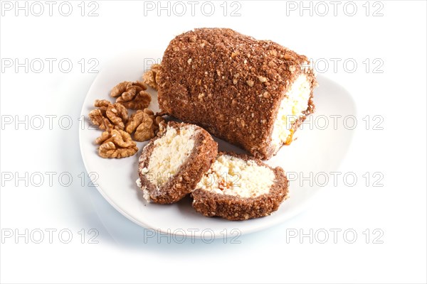 Roll cake with curd and walnuts isolated on white background. close up