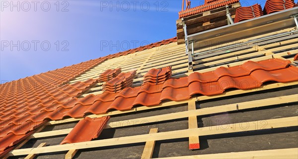 Panoramic image of the roof covering of a new tiled roof on a residential building