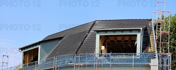 Panoramic image of the roof covering of a new tiled roof on a residential building