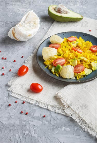 Fried pomelo with tomatoes and avocado on gray concrete background. side view, myanmar food