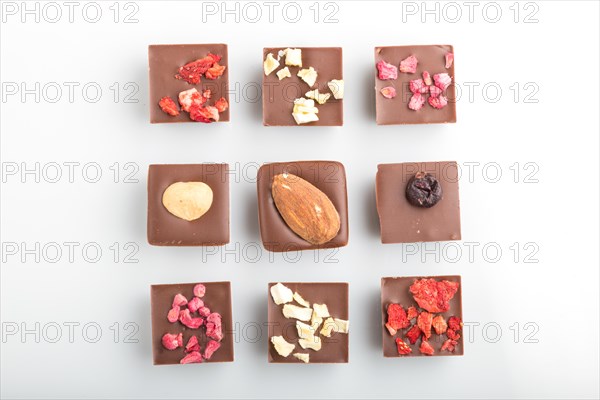 A pieces of homemade chocolate isolated on white background. top view, flat lay, close up