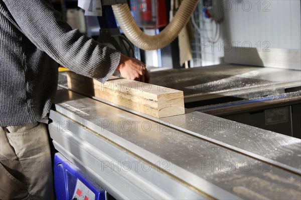 Carpenter at work in his carpentry workshop