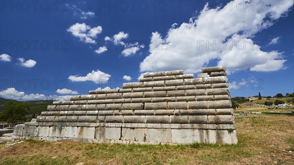 Steps of an ancient theatre under a blue sky in Greece, Archaeological site, Ancient Messene, capital of Messinia, Messini, Peloponnese, Greece, Europe