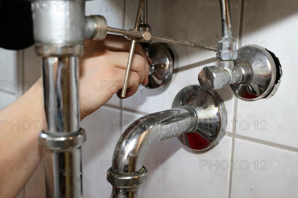 Close-up of sanitary work on a washbasin