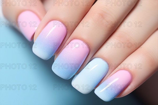 Woman's fingernails with pastel blue and pink ombre nail art design. KI generiert, generiert AI generated