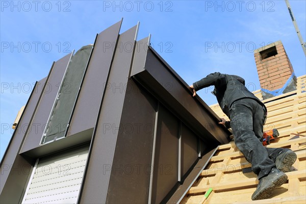 Roofer working on a new dormer window